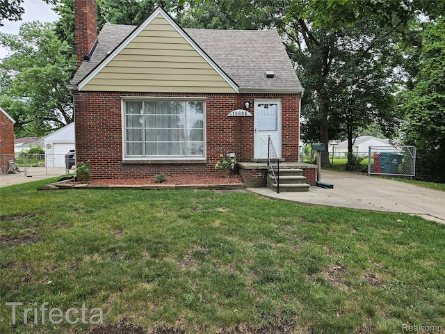 16684 Forest Ave, Harrison Township, MI 48021 - view of front of home with a chimney, brick siding, and roof with shingles