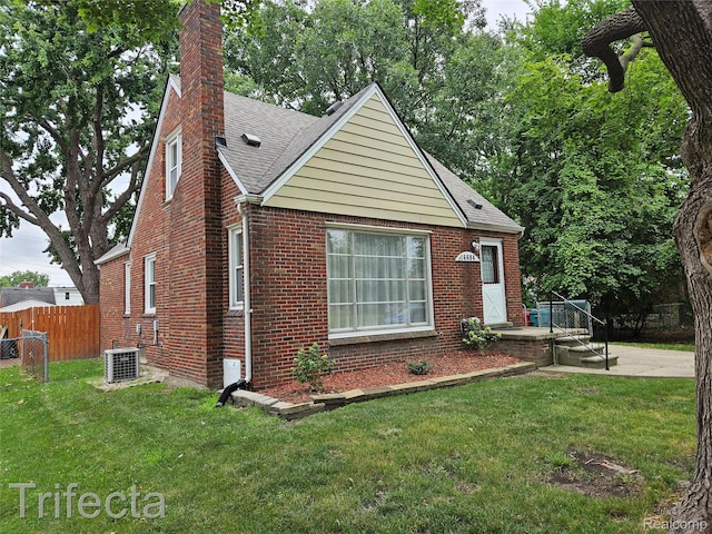16684 Forest Ave, Harrison Township, MI 48021 - view of front facade featuring a shingled roof, brick siding, and a chimney