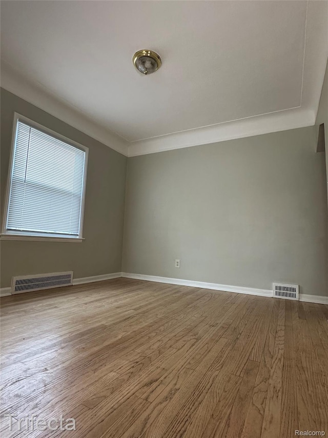 16684 Forest Ave, Harrison Township, MI 48021 - empty room featuring wood finished floors and ornamental molding