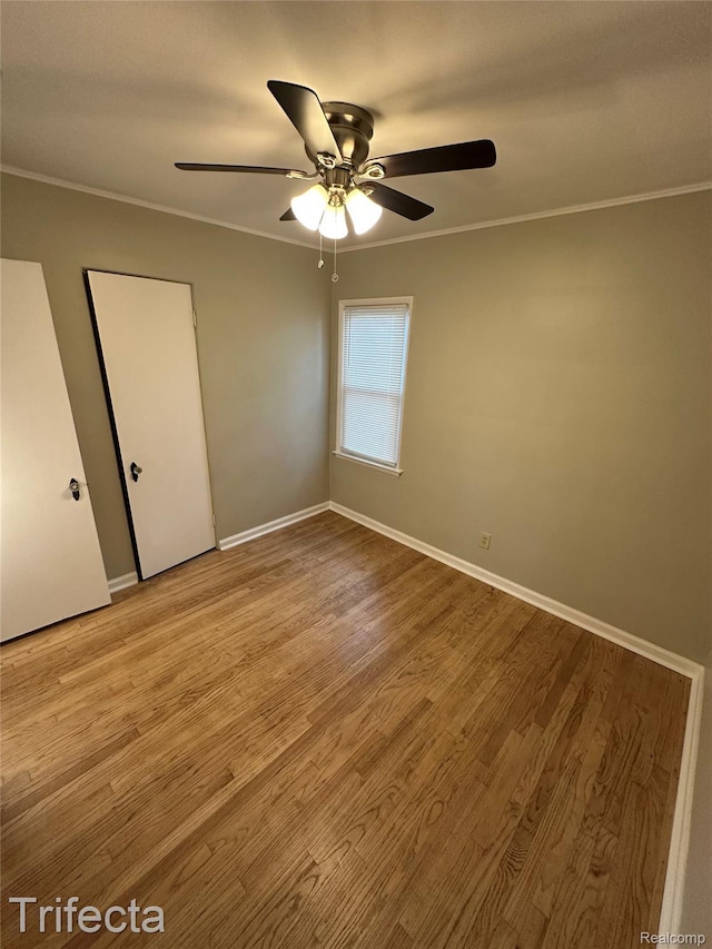 16684 Forest Ave, Harrison Township, MI 48021 - empty room with crown molding, ceiling fan, and wood finished floors
