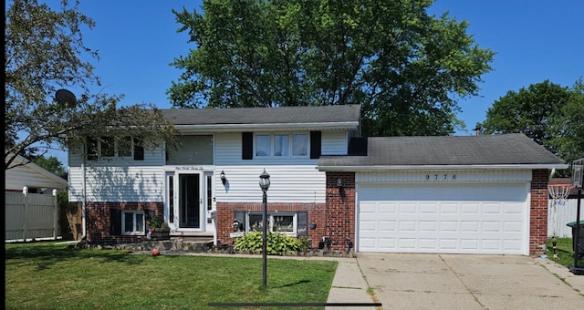 9776 Monroe Blvd, Taylor, MI 48180 - view of front of home featuring brick siding, a garage, and concrete driveway