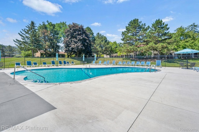 17979 University Park Dr, Livonia, MI 48152 - community pool featuring a patio area