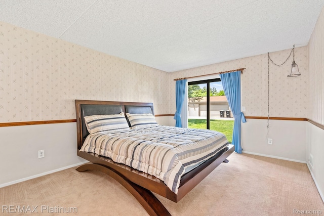 17979 University Park Dr, Livonia, MI 48152 - carpeted bedroom with access to exterior, wallpapered walls, and a textured ceiling