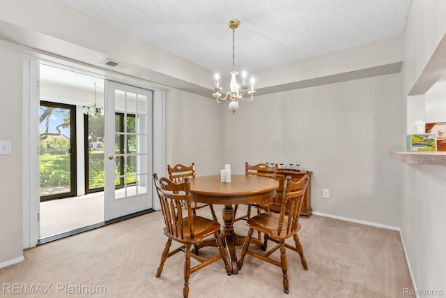 17979 University Park Dr, Livonia, MI 48152 - dining area featuring a chandelier, light carpet, and a textured ceiling