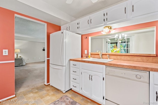 17979 University Park Dr, Livonia, MI 48152 - kitchen with white appliances, white cabinets, light countertops, and light colored carpet