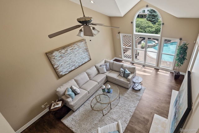 1257 Lake Shore Blvd, Lake Orion, MI 48362 - living area with wood finished floors, ceiling fan, and high vaulted ceiling