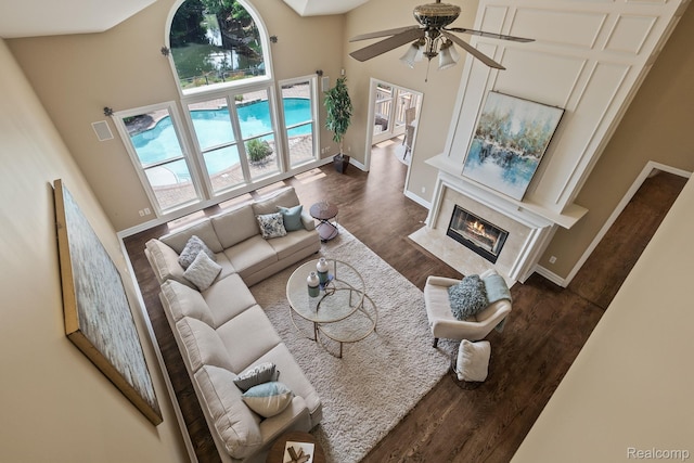 1257 Lake Shore Blvd, Lake Orion, MI 48362 - living area featuring a high ceiling, wood finished floors, ceiling fan, and a high end fireplace