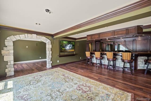 1257 Lake Shore Blvd, Lake Orion, MI 48362 - dining space with wood finished floors, ornamental molding, bar, and arched walkways