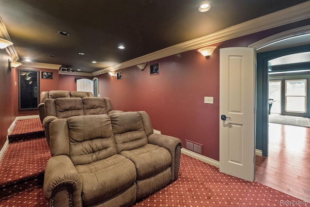 1257 Lake Shore Blvd, Lake Orion, MI 48362 - carpeted cinema featuring crown molding, arched walkways, and recessed lighting