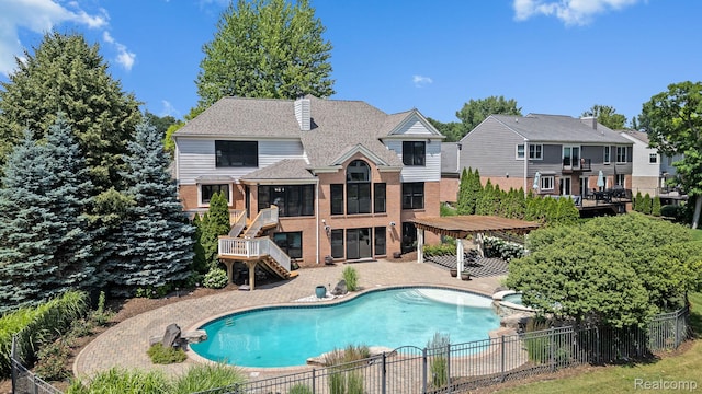 1257 Lake Shore Blvd, Lake Orion, MI 48362 - view of swimming pool with stairs, a patio, and a pool with connected hot tub