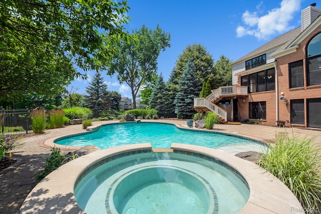 1257 Lake Shore Blvd, Lake Orion, MI 48362 - view of swimming pool featuring a pool with connected hot tub and stairway