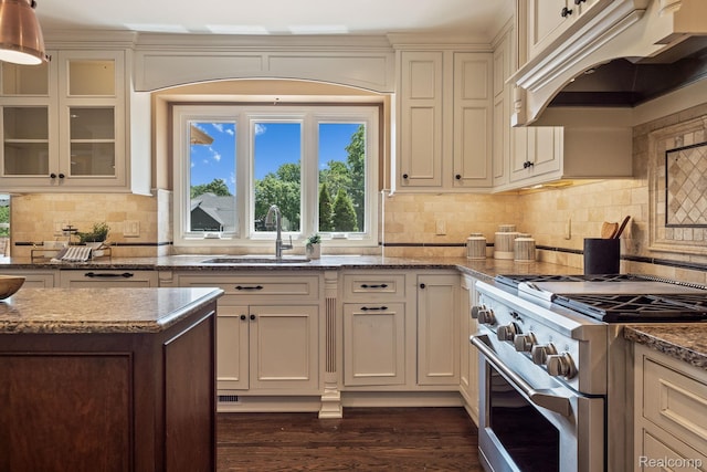 1257 Lake Shore Blvd, Lake Orion, MI 48362 - kitchen featuring high end range, premium range hood, healthy amount of natural light, and dark wood finished floors