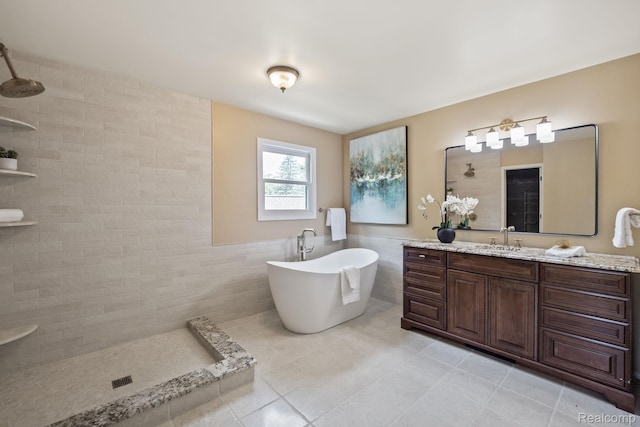1257 Lake Shore Blvd, Lake Orion, MI 48362 - full bathroom with tile walls, tiled shower, vanity, a freestanding tub, and tile patterned flooring
