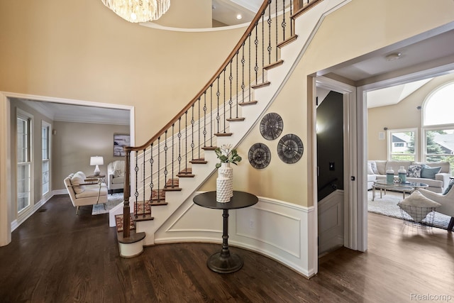 1257 Lake Shore Blvd, Lake Orion, MI 48362 - stairway with wood finished floors, crown molding, a high ceiling, and wainscoting