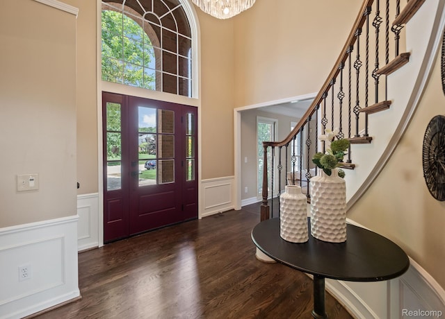 1257 Lake Shore Blvd, Lake Orion, MI 48362 - foyer entrance featuring wainscoting, healthy amount of natural light, wood finished floors, a decorative wall, and stairs