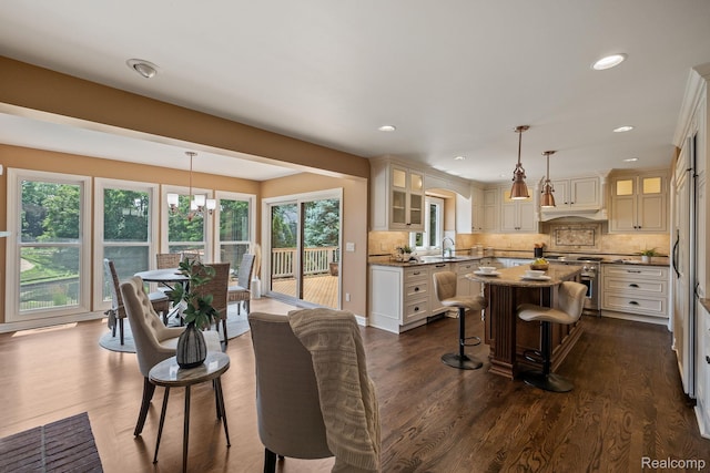 1257 Lake Shore Blvd, Lake Orion, MI 48362 - dining room with dark wood-style flooring, a chandelier, and recessed lighting