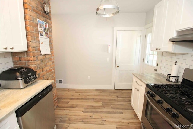 1324-1322 Wayburn St, Grosse Pointe, MI 48230 - kitchen featuring stainless steel appliances, white cabinets, light wood-style flooring, and decorative backsplash