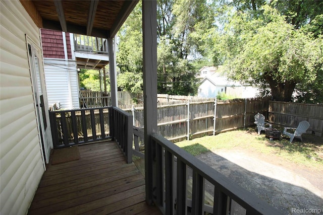 1324-1322 Wayburn St, Grosse Pointe, MI 48230 - wooden terrace featuring a fenced backyard and an outdoor fire pit