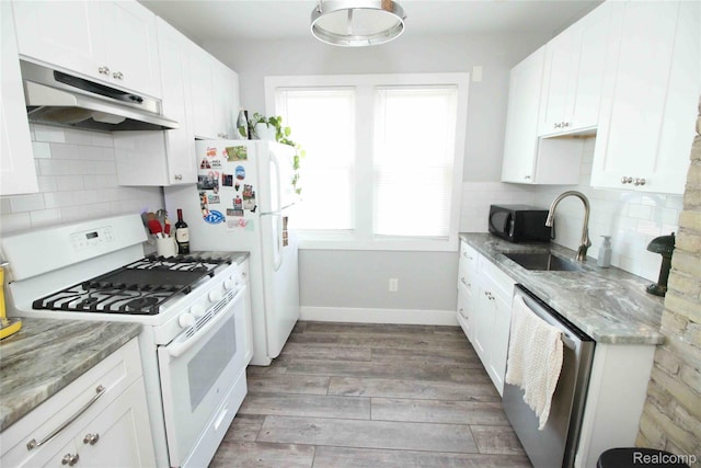1324-1322 Wayburn St, Grosse Pointe, MI 48230 - kitchen with white gas range oven, under cabinet range hood, stainless steel dishwasher, and white cabinets