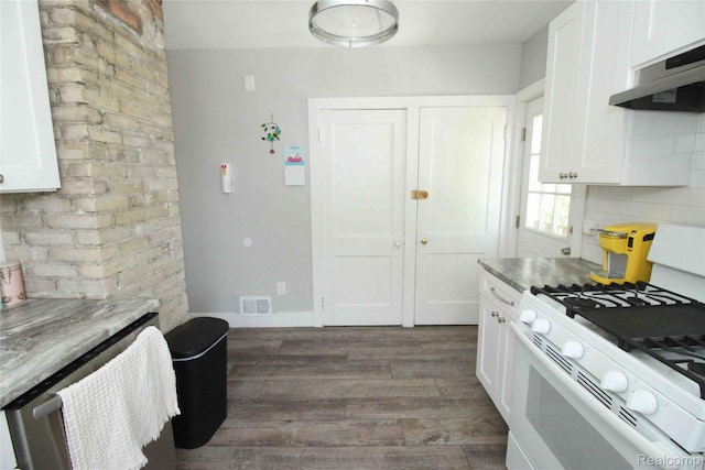 1324-1322 Wayburn St, Grosse Pointe, MI 48230 - kitchen featuring white gas range oven, under cabinet range hood, dark wood-style flooring, white cabinets, and backsplash