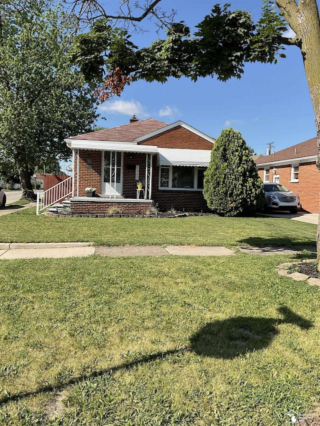 1503 Philomene Blvd, Lincoln Park, MI 48146 - view of front of home featuring brick siding and a front yard