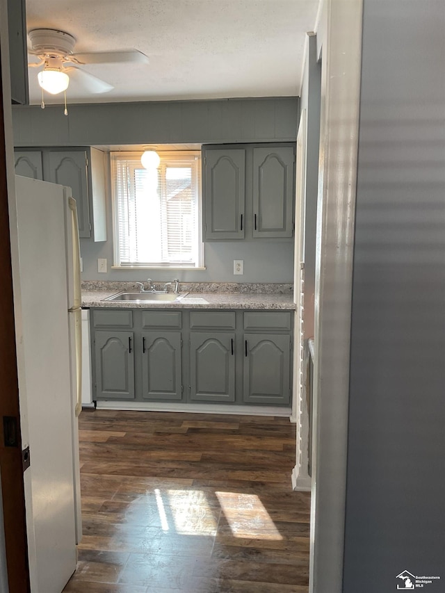 1503 Philomene Blvd, Lincoln Park, MI 48146 - kitchen featuring freestanding refrigerator, dark wood-style floors, a ceiling fan, and light countertops
