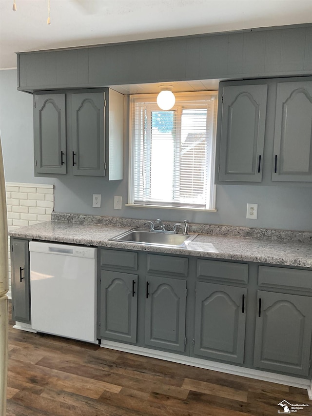 1503 Philomene Blvd, Lincoln Park, MI 48146 - kitchen with white dishwasher, gray cabinets, dark wood-type flooring, and light countertops