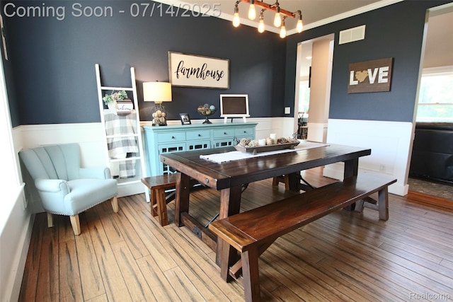 4385 Nelson Scott Dr, Holly, MI 48442 - dining space featuring a wainscoted wall and light wood-type flooring