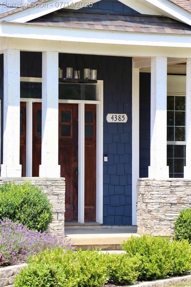 4385 Nelson Scott Dr, Holly, MI 48442 - property entrance with stone siding and covered porch