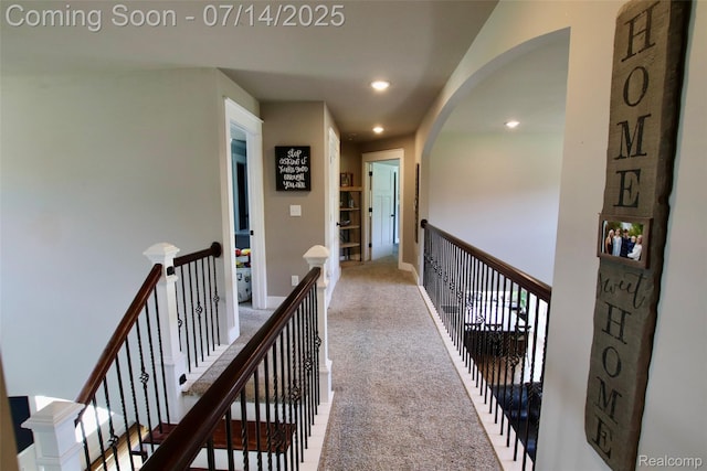 4385 Nelson Scott Dr, Holly, MI 48442 - corridor featuring carpet, arched walkways, recessed lighting, and an upstairs landing