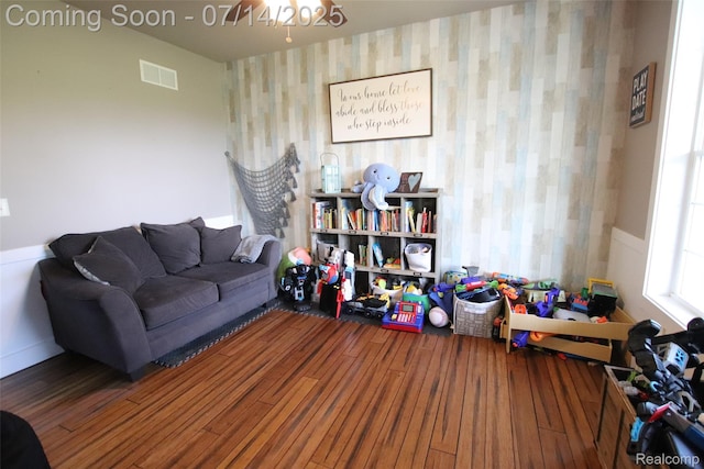 4385 Nelson Scott Dr, Holly, MI 48442 - living room with wallpapered walls and wood finished floors