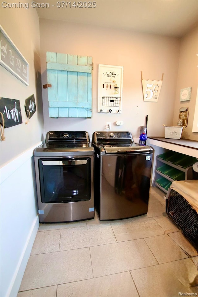 4385 Nelson Scott Dr, Holly, MI 48442 - laundry room with washer and dryer and light tile patterned floors