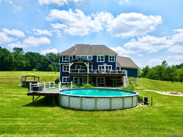 4385 Nelson Scott Dr, Holly, MI 48442 - rear view of property featuring a deck, a yard, and an outdoor pool