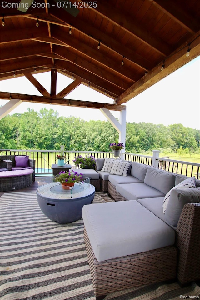 4385 Nelson Scott Dr, Holly, MI 48442 - view of patio / terrace featuring an outdoor living space, a gazebo, and view of wooded area
