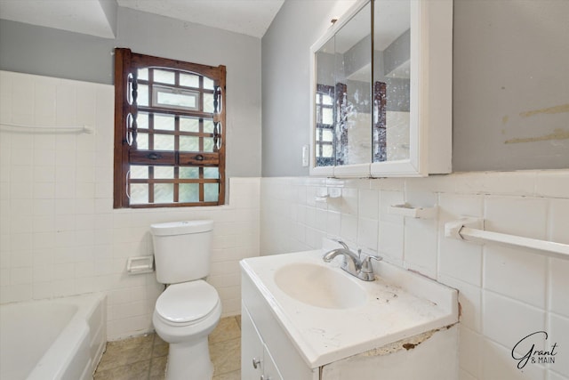 19007 Kentfield St, Detroit, MI 48219 - bathroom with tile walls, vanity, a tub to relax in, and wainscoting