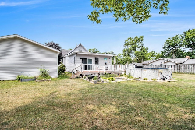 515 Locust St, Howard City, MI 49329 - rear view of property featuring a deck