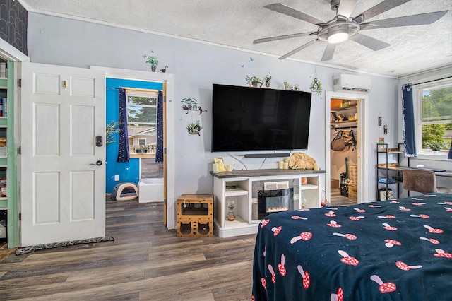 515 Locust St, Howard City, MI 49329 - bedroom with a wall mounted AC, a textured ceiling, wood finished floors, ornamental molding, and a ceiling fan