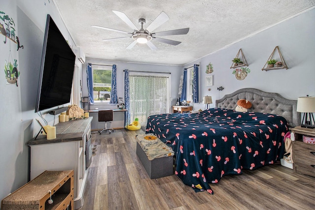515 Locust St, Howard City, MI 49329 - bedroom with wood finished floors, a textured ceiling, an office area, and a ceiling fan