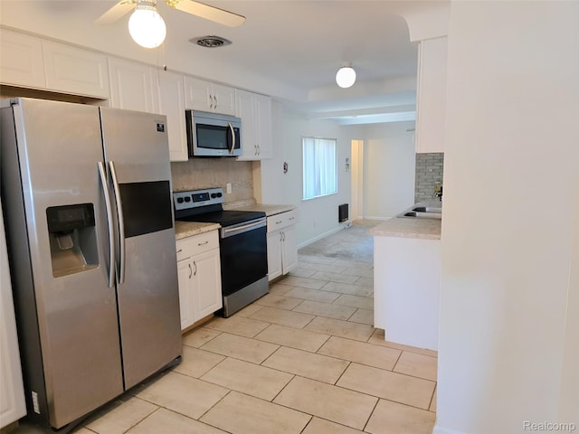 11245 Mae Ave, Warren, MI 48089 - kitchen with appliances with stainless steel finishes, a ceiling fan, light countertops, and tasteful backsplash