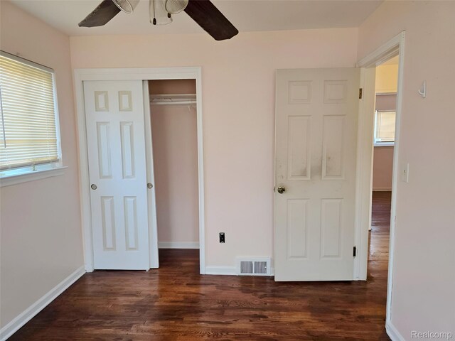 11245 Mae Ave, Warren, MI 48089 - unfurnished bedroom with dark wood-style floors, a closet, and ceiling fan