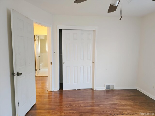 11245 Mae Ave, Warren, MI 48089 - unfurnished bedroom with dark wood finished floors, a closet, and a ceiling fan