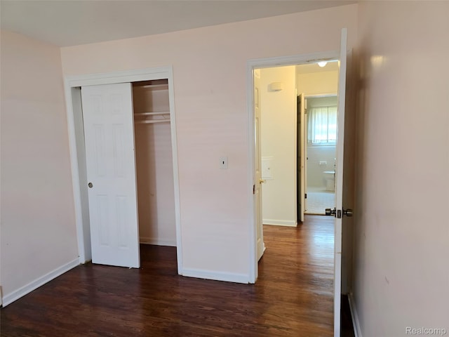 11245 Mae Ave, Warren, MI 48089 - unfurnished bedroom featuring dark wood-style flooring and a closet