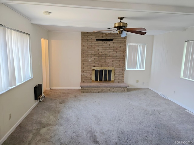 11245 Mae Ave, Warren, MI 48089 - unfurnished living room with a brick fireplace, carpet, beamed ceiling, and ceiling fan