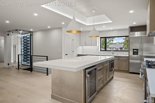 3539 Walbri Dr, Bloomfield Hills, MI 48304 - kitchen featuring wine cooler, high quality appliances, light wood finished floors, a center island, and recessed lighting