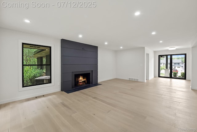 3539 Walbri Dr, Bloomfield Hills, MI 48304 - unfurnished living room featuring light wood-style floors, a large fireplace, and recessed lighting