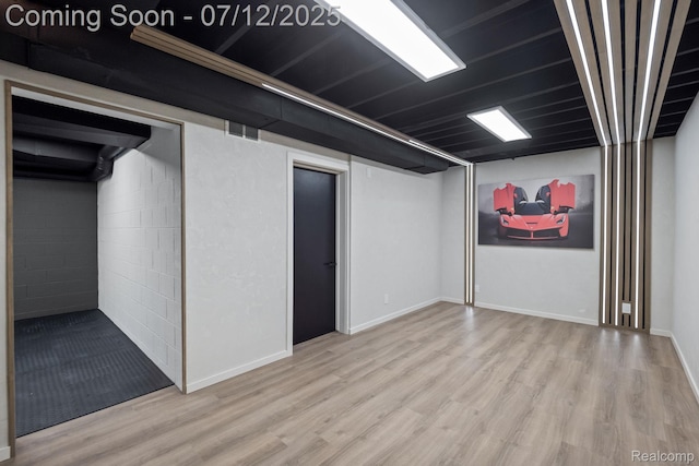 3539 Walbri Dr, Bloomfield Hills, MI 48304 - finished below grade area featuring wood finished floors and concrete block wall