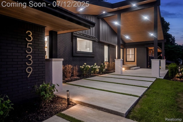 3539 Walbri Dr, Bloomfield Hills, MI 48304 - view of exterior entry with brick siding and board and batten siding