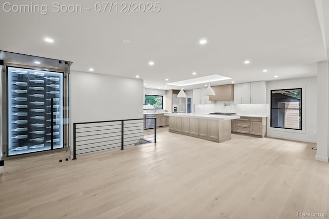 3539 Walbri Dr, Bloomfield Hills, MI 48304 - kitchen featuring recessed lighting, light countertops, stainless steel gas stovetop, light wood-style floors, and a center island