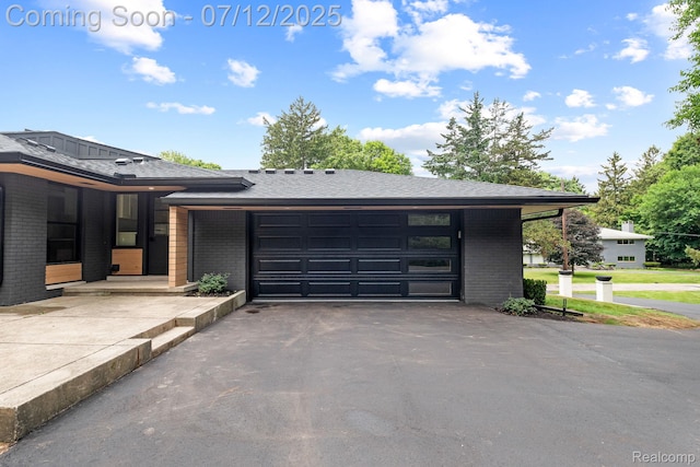 3539 Walbri Dr, Bloomfield Hills, MI 48304 - view of front facade with brick siding, asphalt driveway, and an attached garage