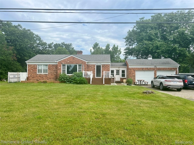 7270 Elizabeth Lake Rd, Waterford, MI 48327 - view of front of property featuring a chimney, brick siding, and a front yard